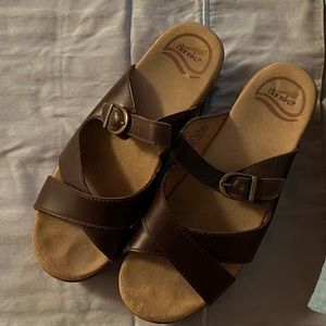 Dansko sandals, brown, slightly worn.